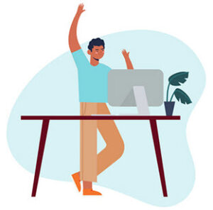 Person celebrating at a desk with a computer, symbolizing successful onboarding for WordPress support services at Secure WP Solutions.